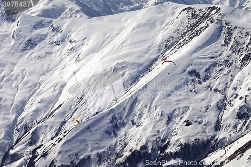 Image of Paragliders of snowy mountains