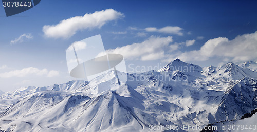 Image of Snowy winter mountains in sun day. Panoramic view.