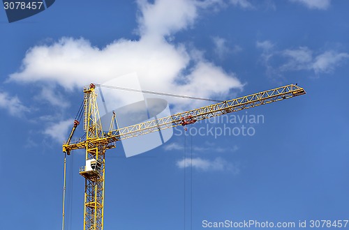 Image of Construction crane against blue sky