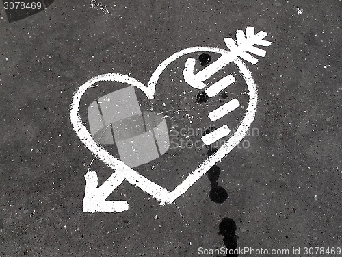 Image of Abstract love symbol on pavement