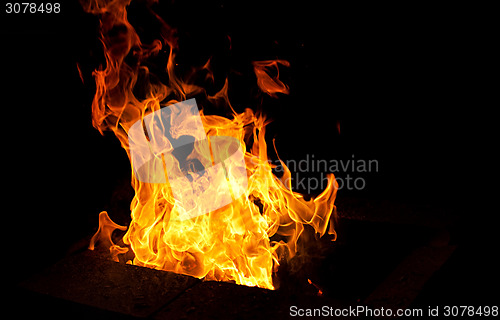 Image of big flame on dark background