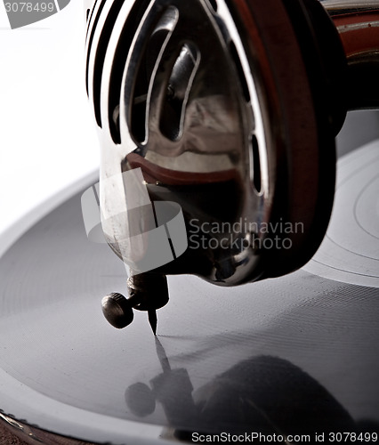 Image of gramophone needle playing record