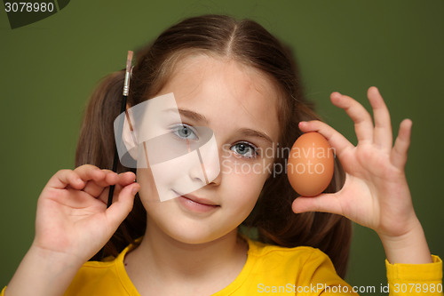 Image of Girl painted Easter eggs