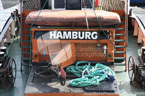 Image of details of  Old german boat with a title "Hamburg" in a port Ham