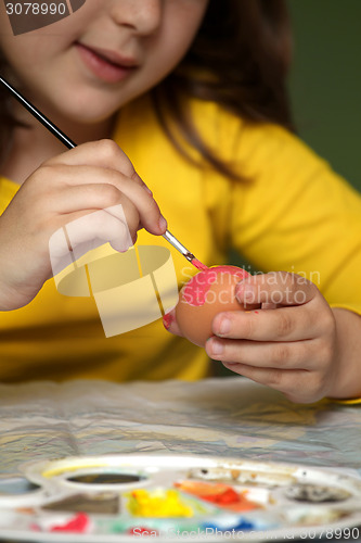 Image of Girl painted Easter eggs