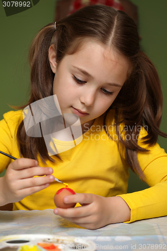 Image of Girl painted Easter eggs