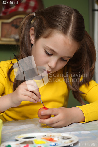 Image of Girl painted Easter eggs