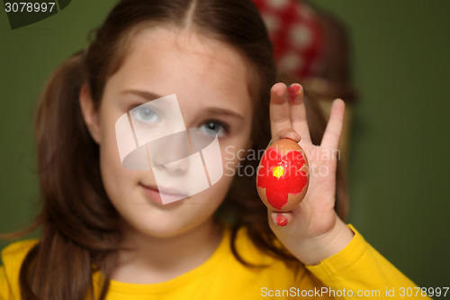 Image of Girl painted Easter eggs