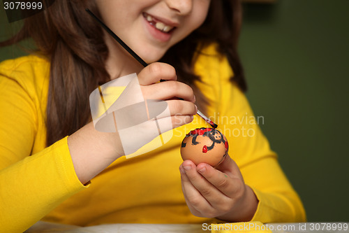 Image of Girl painted Easter eggs