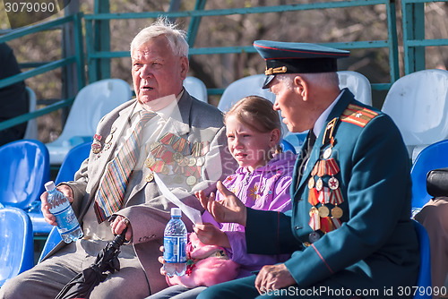 Image of Senior veterans of World War II on tribune