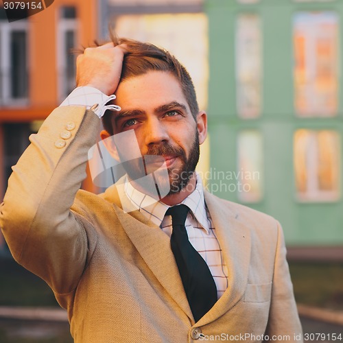 Image of young man posing in the street