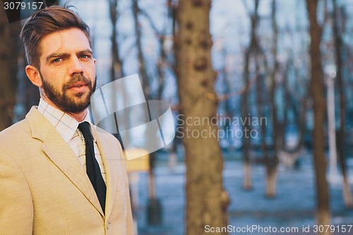 Image of young man posing in the street