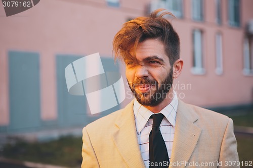 Image of young man posing in the street