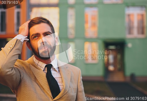 Image of young man posing in the street