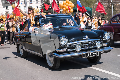 Image of Old-fashioned car GAZ-21 participates in parade