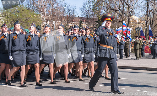 Image of Women - cadets of police academy march on parade