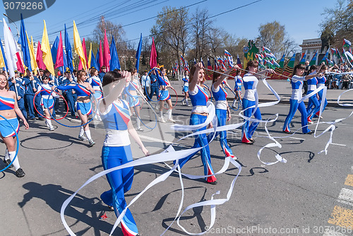 Image of Attractive girls with gymnstics tapes on parade