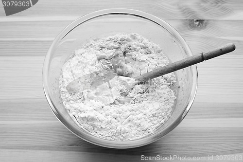 Image of Flour being stirred into batter for banana bread
