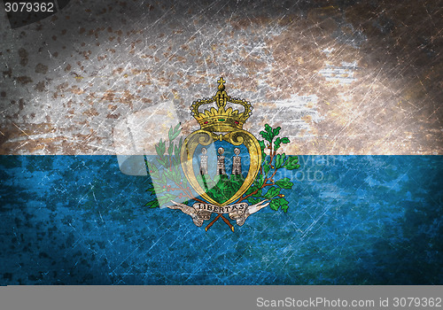 Image of Old rusty metal sign with a flag