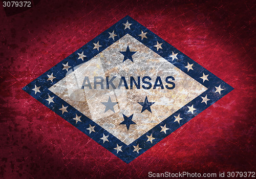 Image of Old rusty metal sign with a flag