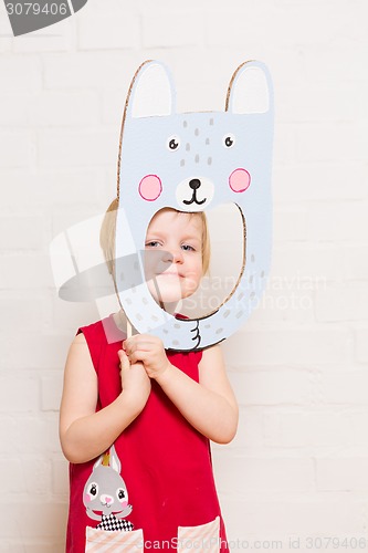 Image of Little girls holding rabbit mask on white background