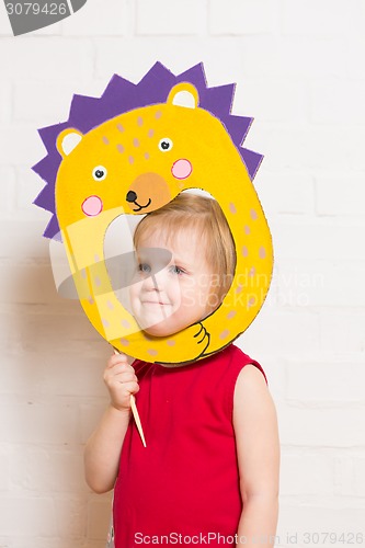 Image of Little girls holding hedgehog mask on white background