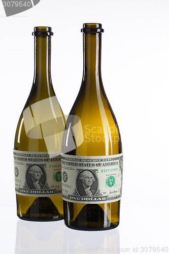 Image of Empty bottles of wine from the label of dollar bill 