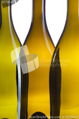 Image of Detail of three empty wine bottles