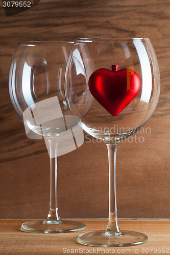 Image of Two glasses  of wine and red heart
