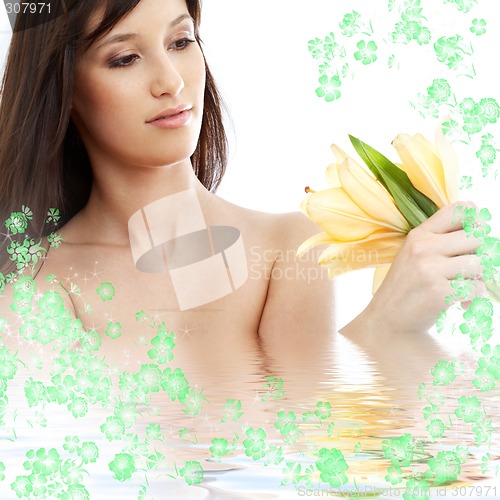 Image of happy brunette with flowers in water #2