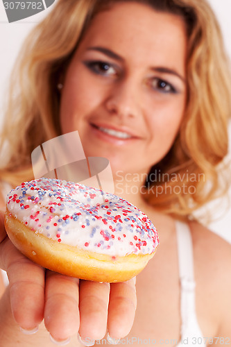 Image of Colorful muffin in hand