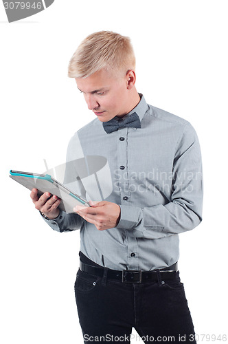 Image of Young man using digital tablet 