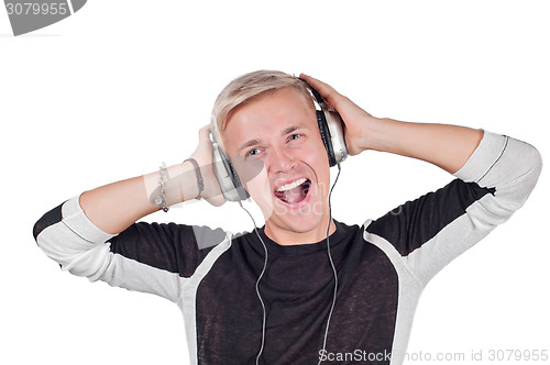 Image of Young handsome man singing with headphones 
