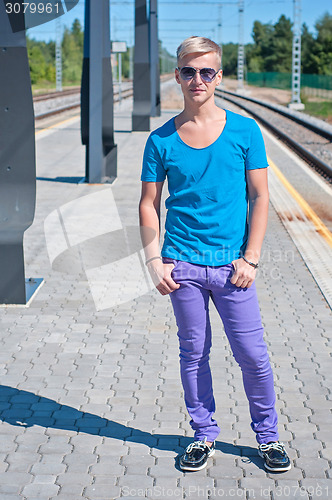 Image of Good looking caucasian male in blue