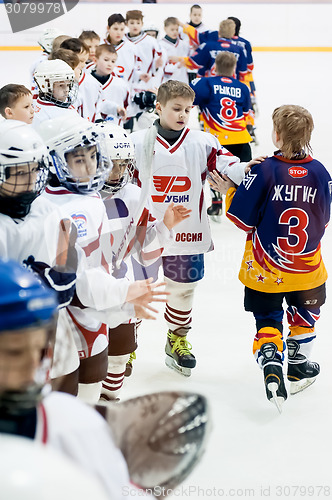 Image of Child hockey. Greeting of players after game