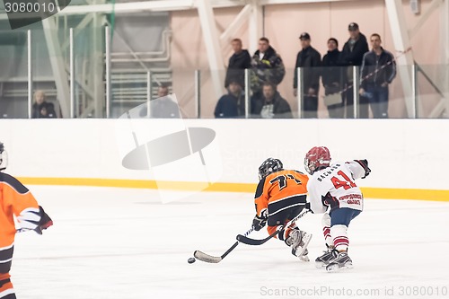 Image of Game of children ice-hockey teams