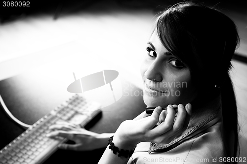 Image of Woman sitting at helpdesk