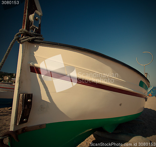 Image of fishing boat on the sand