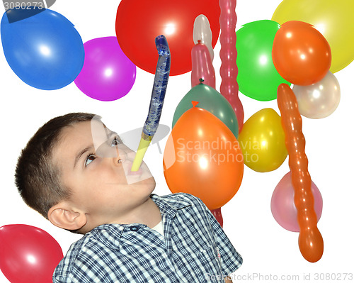Image of Happy boy play with air whistle