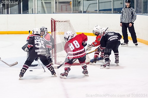 Image of Game of children ice-hockey teams