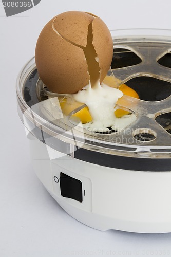 Image of broken egg in cooker