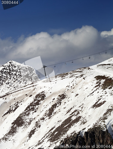 Image of Off-piste slope and chair-lift in little snow year