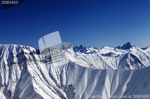 Image of Snowy rocks in winter sun day