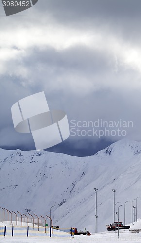 Image of Ski slope and storm clouds in evening