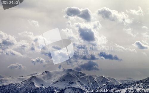 Image of Evening mountains and sunlight cloudy sky