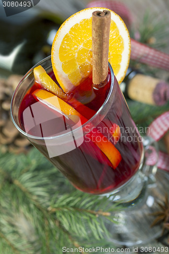 Image of Hot drink of wine, spices and fruits.