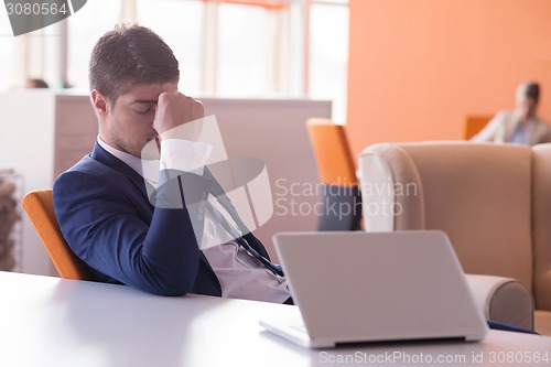 Image of frustrated young business man