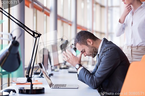 Image of frustrated young business man