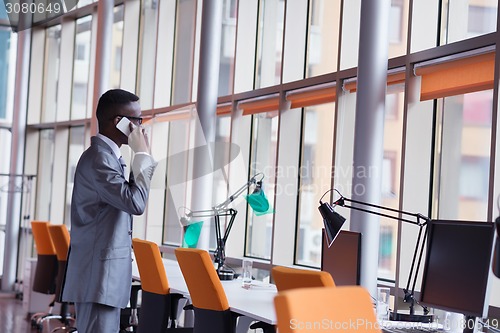 Image of African American businessman talk by phone