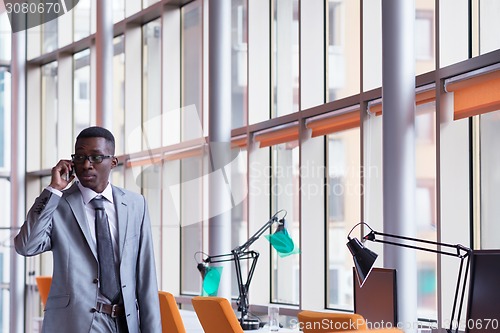 Image of African American businessman talk by phone